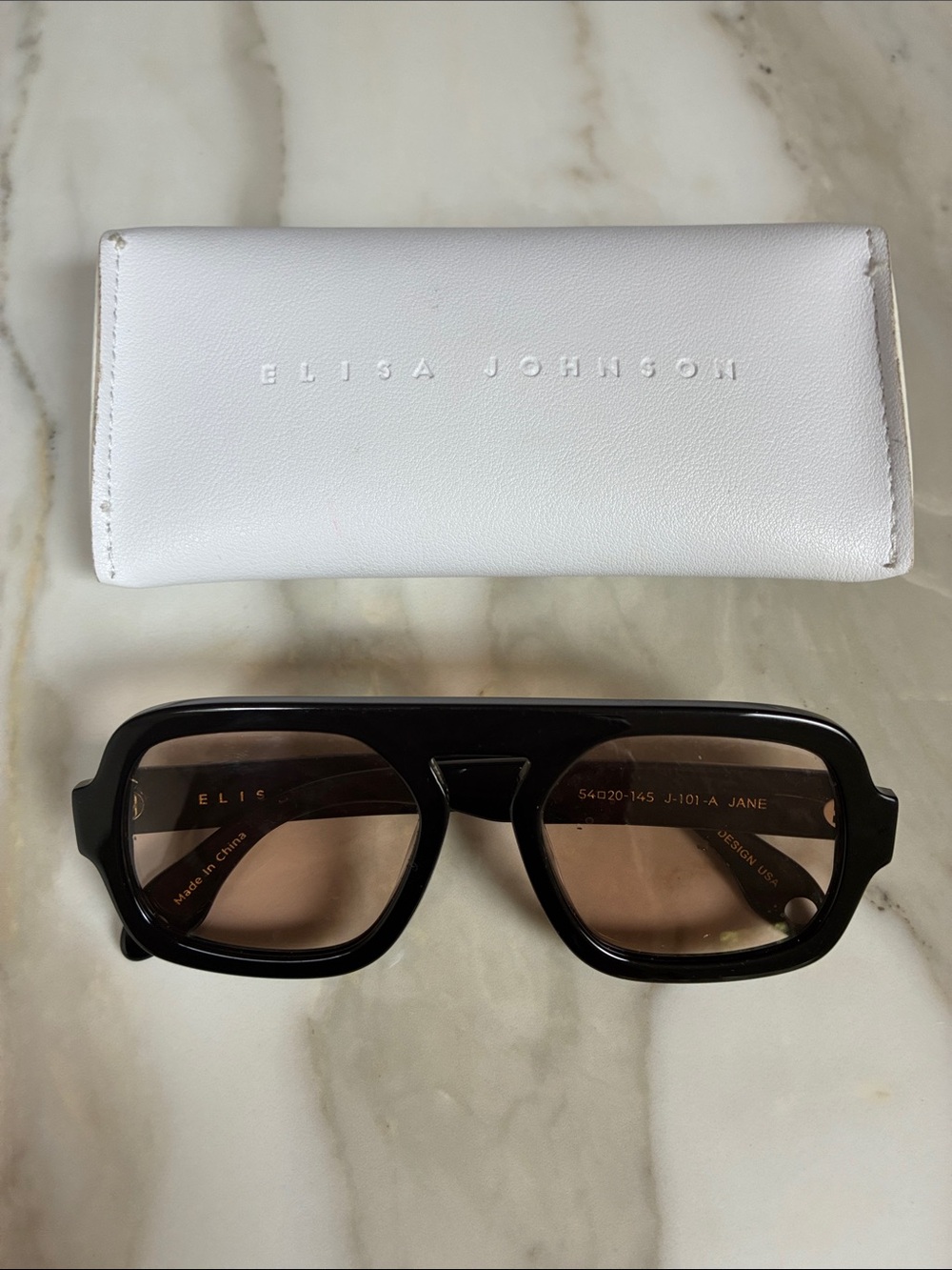 Elisa Johnson Men’s Black Sunglasses with Brown Lenses